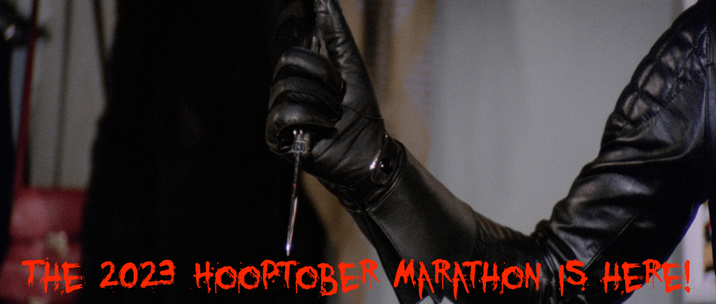 Announcing the 2023 Hooptober kickoff! Bloody letters announce it with a leather gloved hand holding a knife in the background