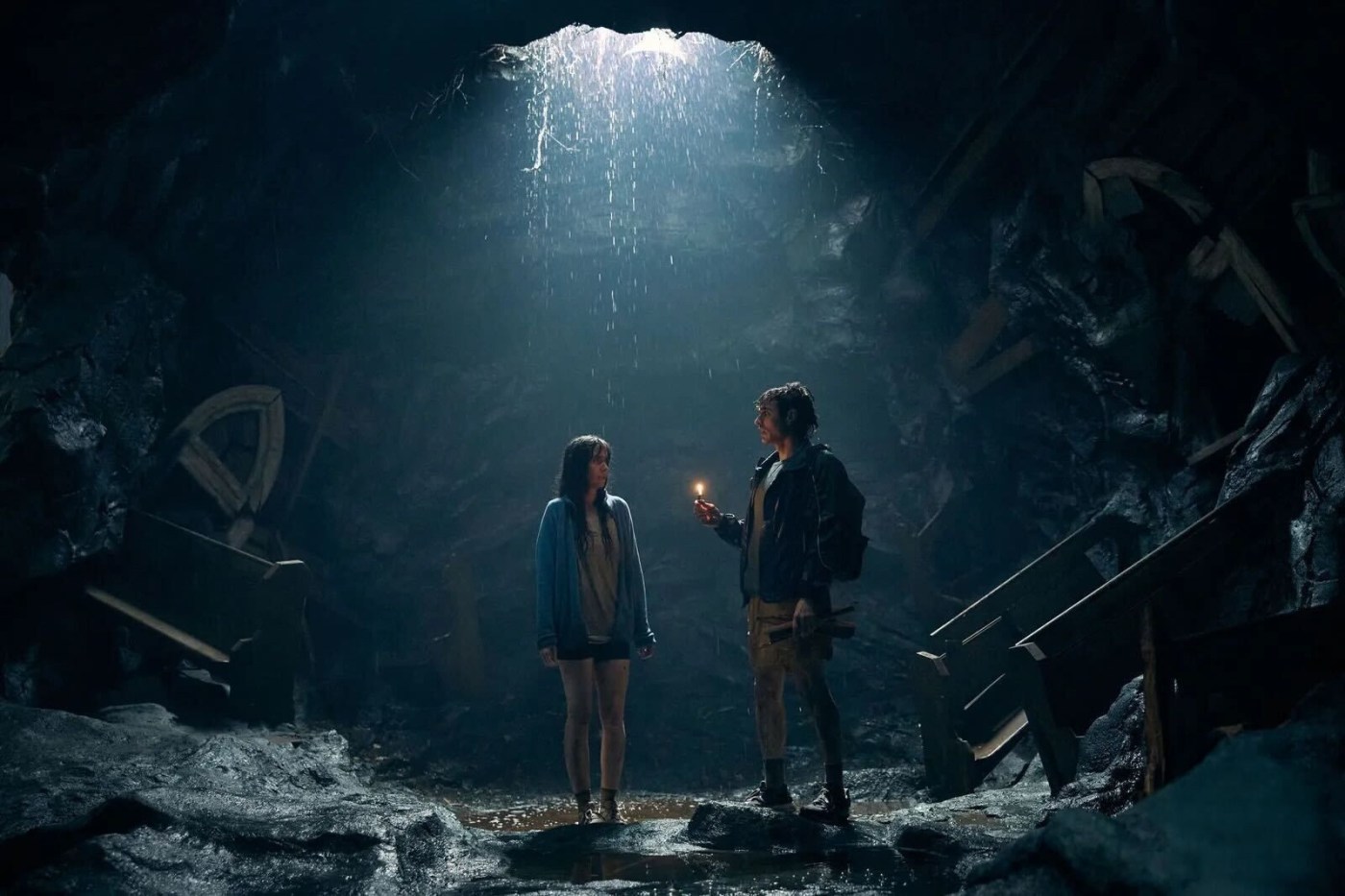 image from the film Together: alison brie and dave franco trapped in a hole, the opening casting light down on them