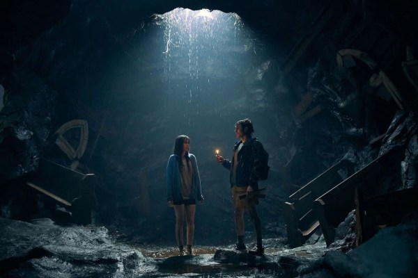 image from the film Together: alison brie and dave franco trapped in a hole, the opening casting light down on them