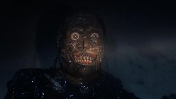 a close up of a zombie face